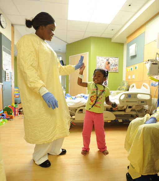 hospital-high-five Doctor gives young patient high five