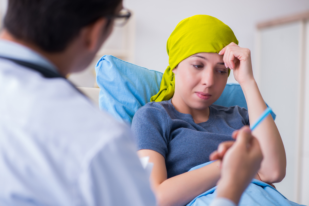 Cancer patient visiting doctor for medical consultation in clinic