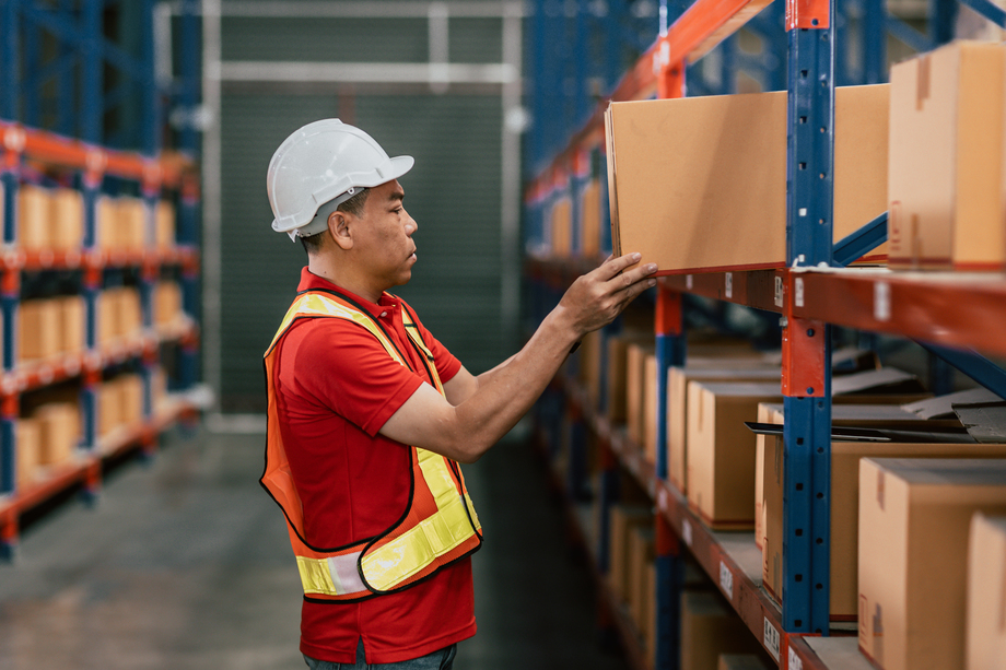 Warehouse staff worker cargo inventory products box store house with Asian worker man